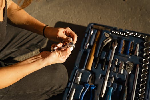 plumber reviewing plans and inventory in a workshop