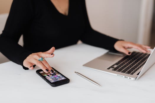 image of plumber using mobile device